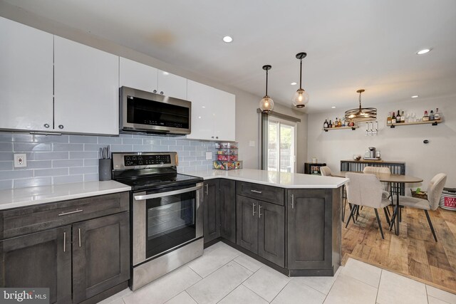 34 Pittman Ln, Sicklerville, NJ 08081 - kitchen with light countertops, white cabinetry, appliances with stainless steel finishes, and light tile patterned flooring