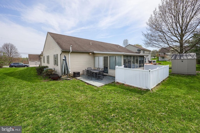 771 W Ridge Rd, Elizabethtown, PA 17022 - rear view of house featuring a storage shed, an outbuilding, a patio area, a sunroom, and a yard