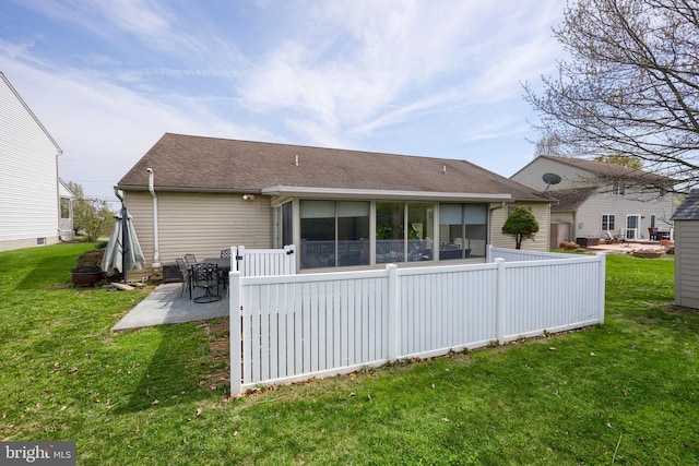 771 W Ridge Rd, Elizabethtown, PA 17022 - rear view of house with roof with shingles, a yard, a sunroom, and a patio area