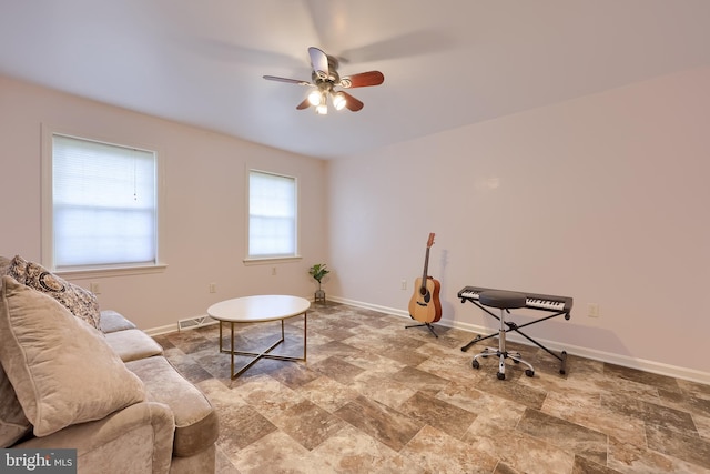 771 W Ridge Rd, Elizabethtown, PA 17022 - living area featuring visible vents, a ceiling fan, baseboards, and stone finish floor