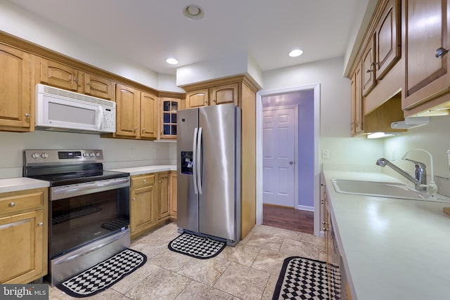 771 W Ridge Rd, Elizabethtown, PA 17022 - kitchen with light countertops, appliances with stainless steel finishes, glass insert cabinets, and a sink
