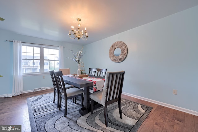 771 W Ridge Rd, Elizabethtown, PA 17022 - dining area featuring a notable chandelier, visible vents, baseboards, and hardwood / wood-style floors