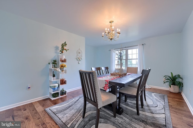 771 W Ridge Rd, Elizabethtown, PA 17022 - dining space featuring baseboards, wood finished floors, and a chandelier