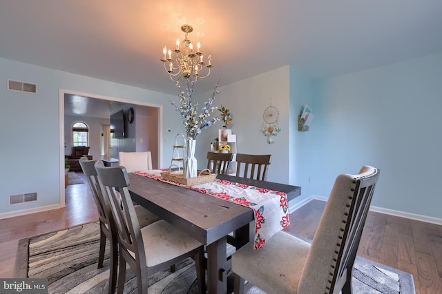 771 W Ridge Rd, Elizabethtown, PA 17022 - dining room with baseboards, a chandelier, wood finished floors, and visible vents