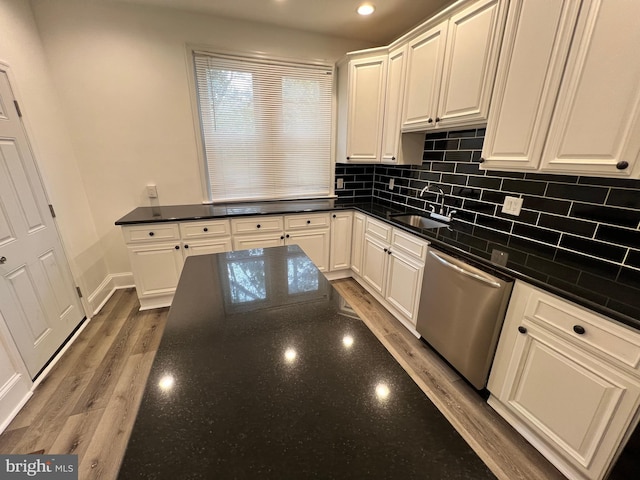 6232 N 10th St, Philadelphia, PA 19141 - kitchen with recessed lighting, dishwasher, wood finished floors, a sink, and decorative backsplash