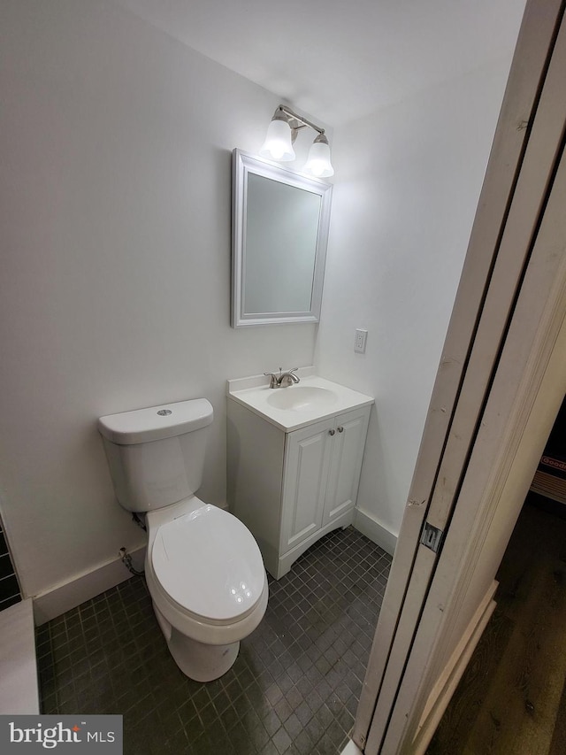 6232 N 10th St, Philadelphia, PA 19141 - bathroom featuring baseboards, vanity, tile patterned flooring, and toilet