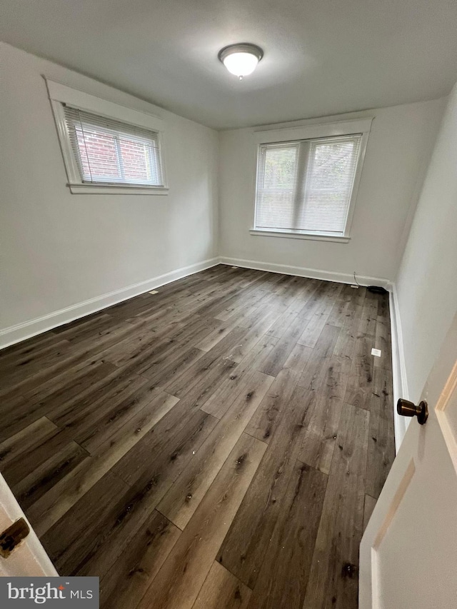 6232 N 10th St, Philadelphia, PA 19141 - empty room featuring baseboards and dark wood finished floors
