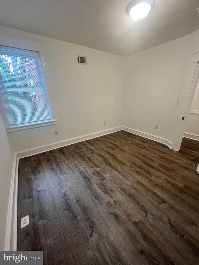 6232 N 10th St, Philadelphia, PA 19141 - spare room featuring dark wood-type flooring, visible vents, and baseboards