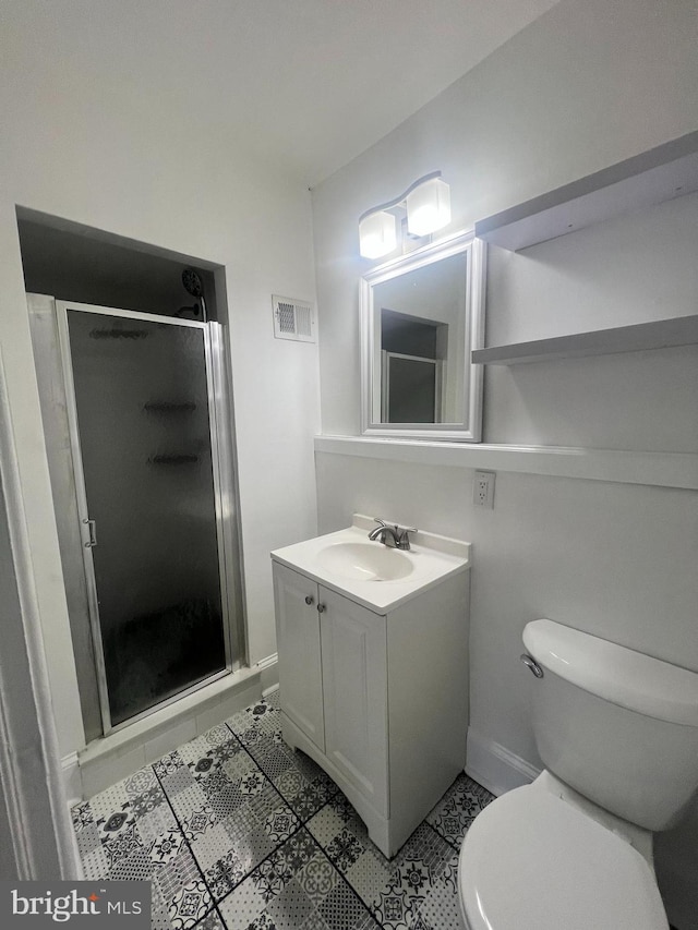 6232 N 10th St, Philadelphia, PA 19141 - bathroom featuring toilet, a stall shower, vanity, baseboards, and tile patterned flooring