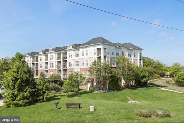 view of home's community with a lawn