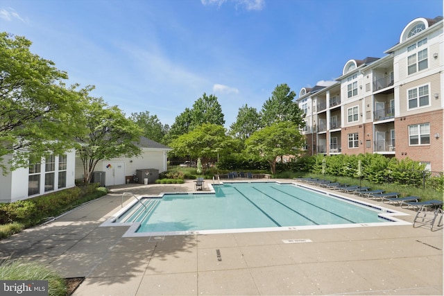 pool featuring central AC and a patio area