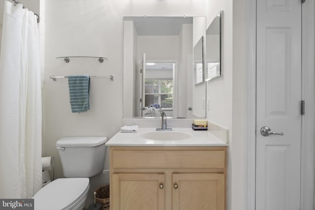 full bathroom with vanity and toilet