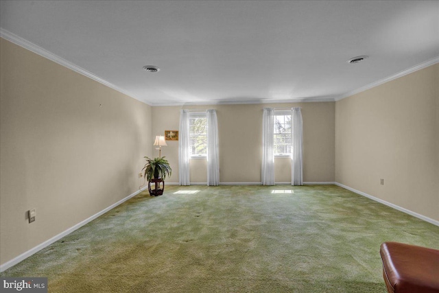 carpeted empty room with crown molding, baseboards, and visible vents