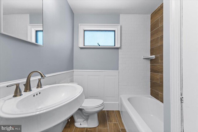 500 Klockner Rd, Hamilton, NJ 08619 - full bath featuring wood finished floors, toilet, a wainscoted wall, and a sink