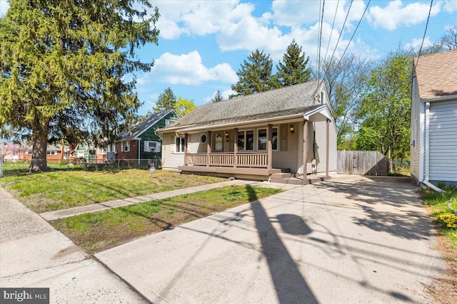 500 Klockner Rd, Hamilton, NJ 08619 - bungalow-style house with covered porch, fence, a shingled roof, a front lawn, and concrete driveway