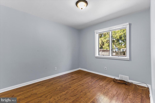 500 Klockner Rd, Hamilton, NJ 08619 - empty room featuring visible vents, baseboards, and dark wood-type flooring