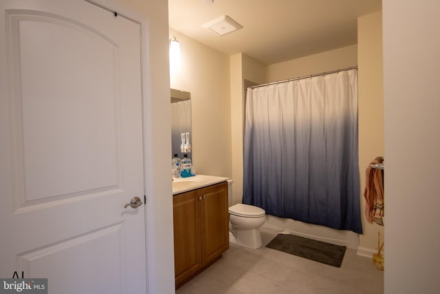 bathroom featuring vanity, tile patterned flooring, and toilet