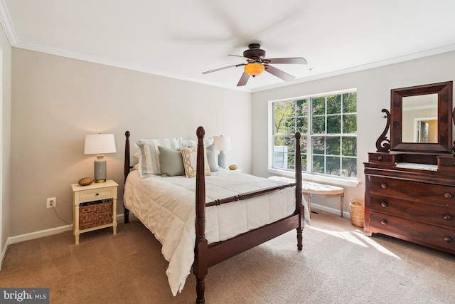 bedroom featuring baseboards, ornamental molding, and carpet flooring
