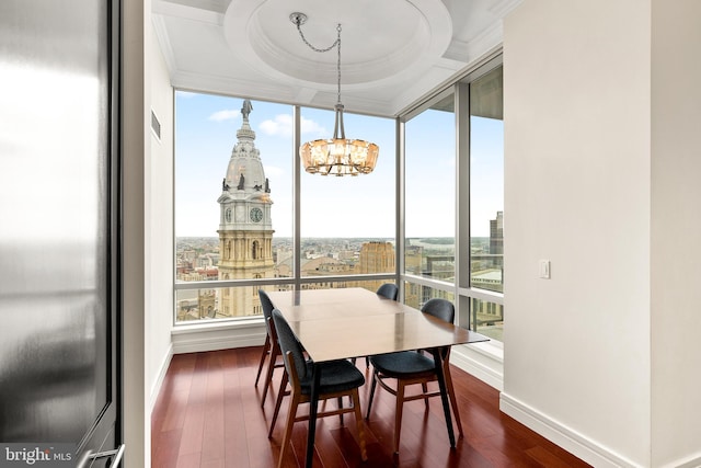 1414 S Penn Sq Unit 34B, Philadelphia, PA 19102 - dining space with dark wood-type flooring, baseboards, ornamental molding, and a notable chandelier