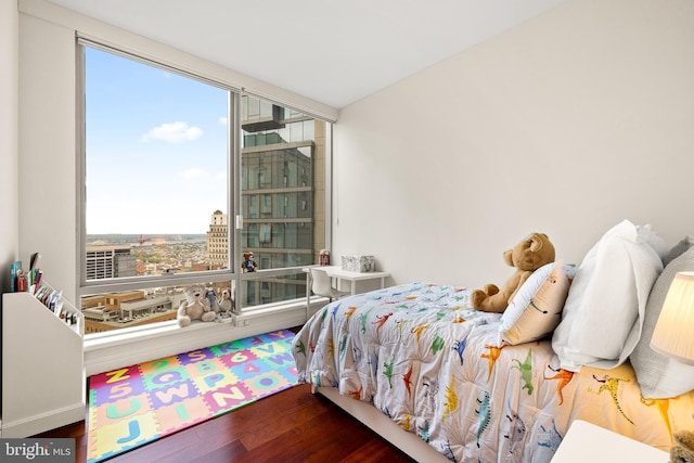 1414 S Penn Sq Unit 34B, Philadelphia, PA 19102 - bedroom featuring multiple windows, expansive windows, and wood finished floors