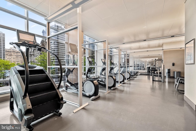1414 S Penn Sq Unit 34B, Philadelphia, PA 19102 - workout area featuring a view of city, a wall of windows, and plenty of natural light
