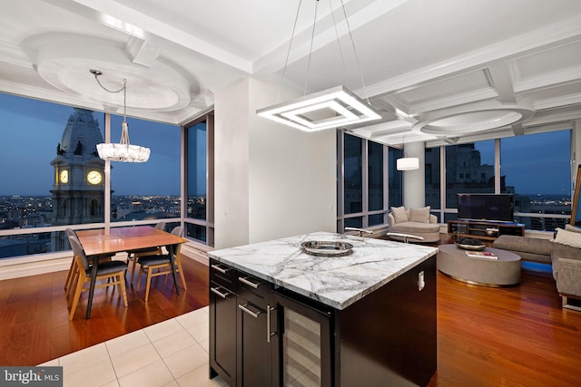 1414 S Penn Sq Unit 34B, Philadelphia, PA 19102 - kitchen featuring beverage cooler, crown molding, coffered ceiling, and a notable chandelier
