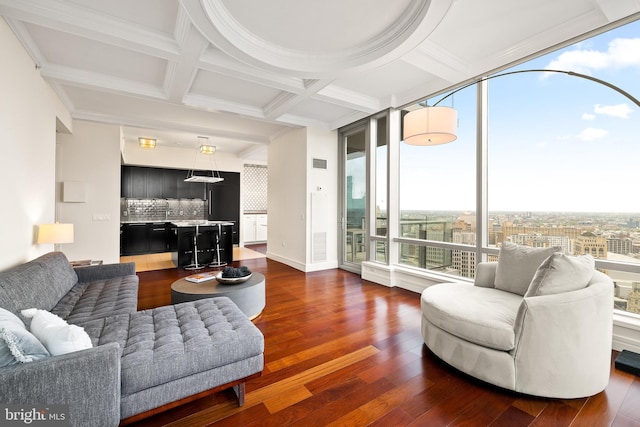 1414 S Penn Sq Unit 34B, Philadelphia, PA 19102 - living room featuring beamed ceiling, coffered ceiling, and dark wood-style flooring