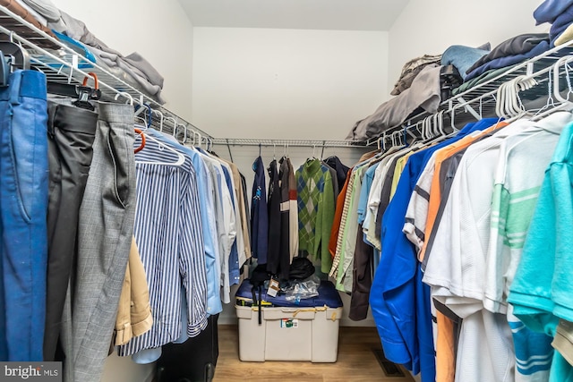 spacious closet featuring wood finished floors and visible vents