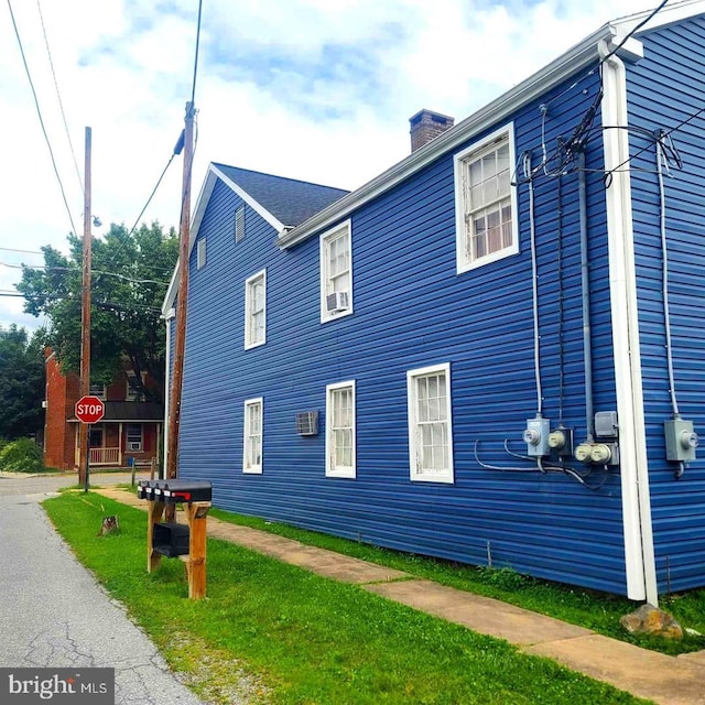 view of side of home with a chimney