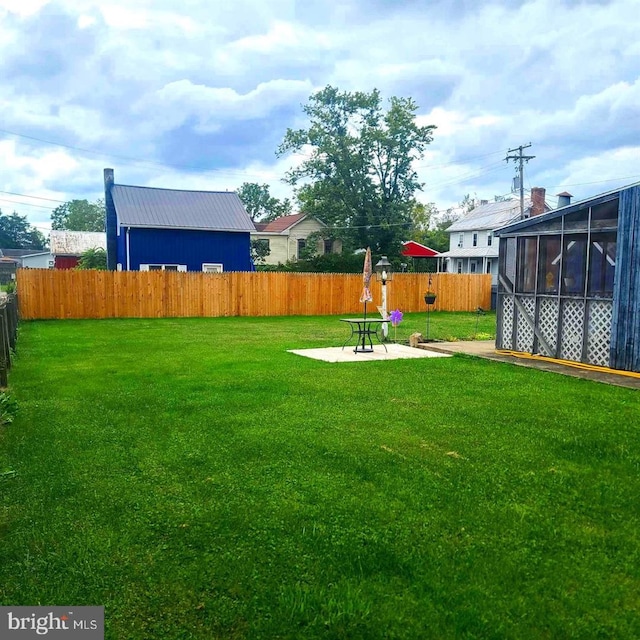 view of yard with a patio and a fenced backyard
