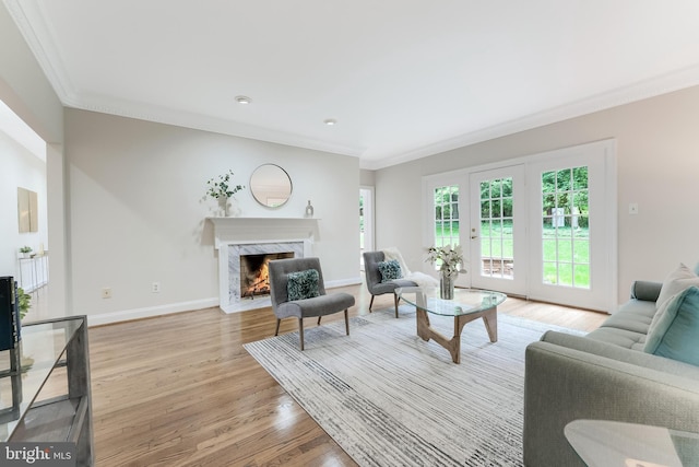 12600 Tolman Rd, Fairfax, VA 22033 - living area featuring light wood-style flooring, crown molding, a premium fireplace, and baseboards