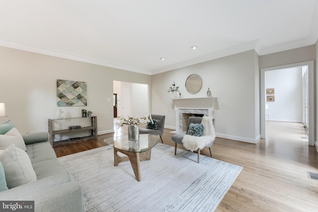 12600 Tolman Rd, Fairfax, VA 22033 - living area with wood finished floors, a fireplace, crown molding, baseboards, and recessed lighting