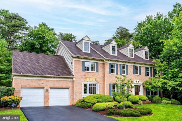 12600 Tolman Rd, Fairfax, VA 22033 - colonial house with driveway, brick siding, and a garage