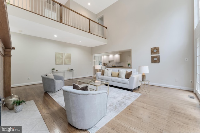 12600 Tolman Rd, Fairfax, VA 22033 - living area with a towering ceiling, baseboards, wood finished floors, and recessed lighting