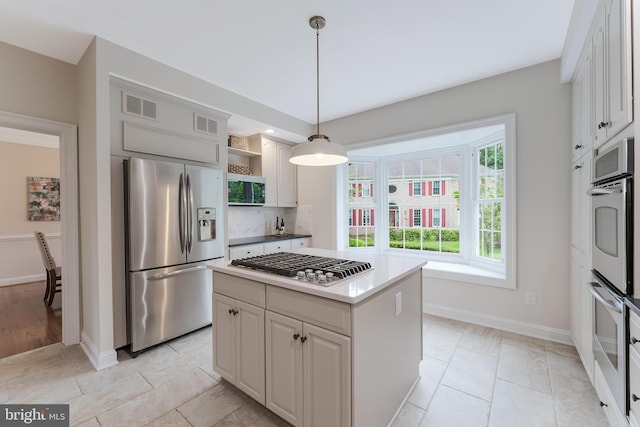 12600 Tolman Rd, Fairfax, VA 22033 - kitchen with stainless steel appliances, open shelves, baseboards, and a kitchen island