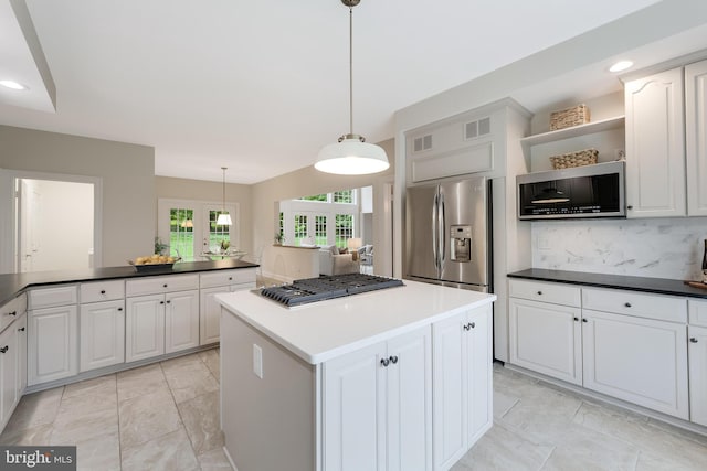12600 Tolman Rd, Fairfax, VA 22033 - kitchen with appliances with stainless steel finishes, open shelves, a kitchen island, tasteful backsplash, and white cabinets