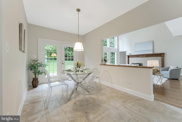 12600 Tolman Rd, Fairfax, VA 22033 - dining area with plenty of natural light, a fireplace, baseboards, and light marble finish floors