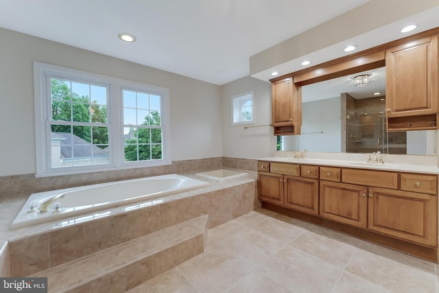 12600 Tolman Rd, Fairfax, VA 22033 - full bathroom with vanity, a garden tub, a stall shower, tile patterned floors, and recessed lighting