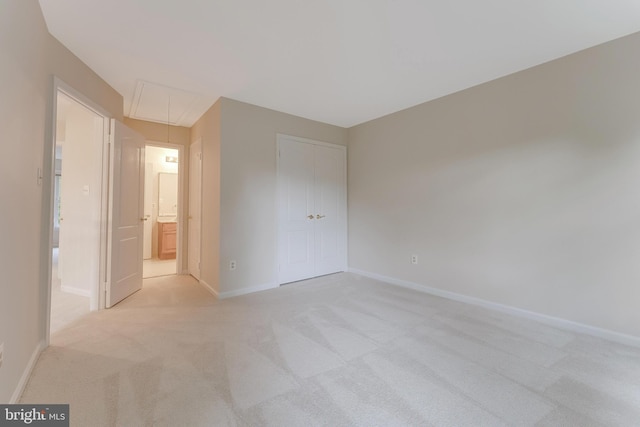 12600 Tolman Rd, Fairfax, VA 22033 - unfurnished bedroom with attic access, light carpet, and baseboards