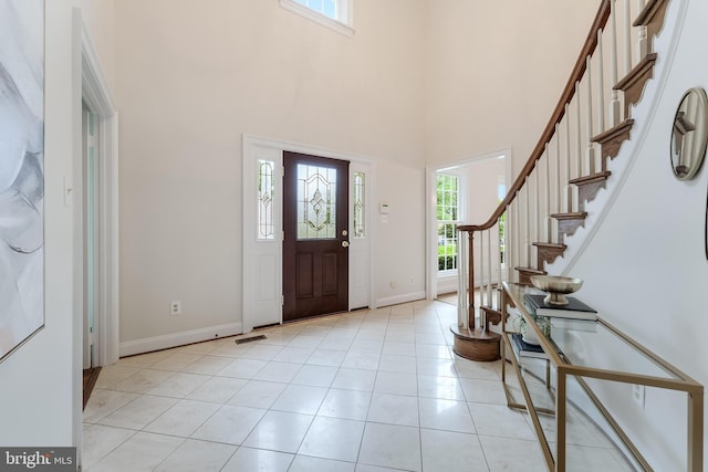 12600 Tolman Rd, Fairfax, VA 22033 - foyer featuring a towering ceiling, baseboards, light tile patterned floors, and stairs
