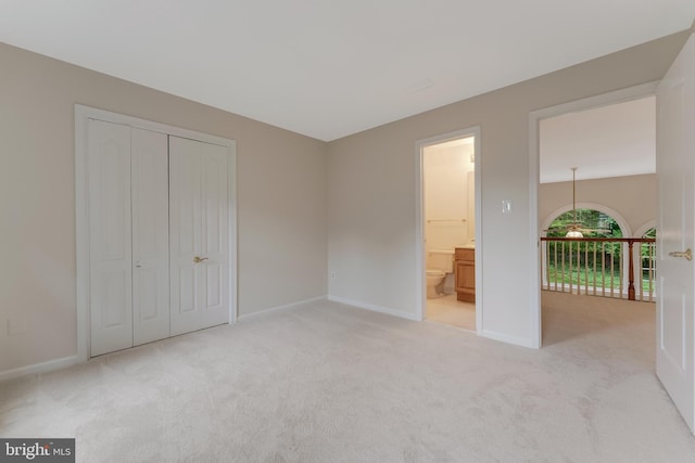 12600 Tolman Rd, Fairfax, VA 22033 - unfurnished bedroom with light colored carpet, baseboards, a closet, and connected bathroom