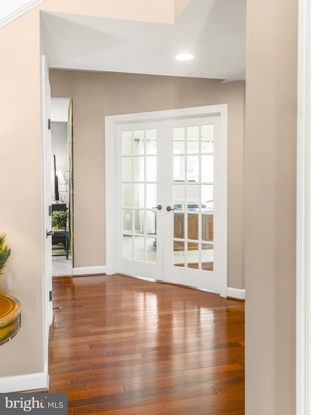 doorway to outside featuring baseboards, wood-type flooring, french doors, and recessed lighting
