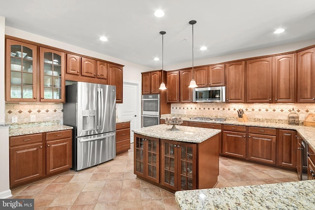 kitchen featuring backsplash, appliances with stainless steel finishes, light stone countertops, glass insert cabinets, and recessed lighting