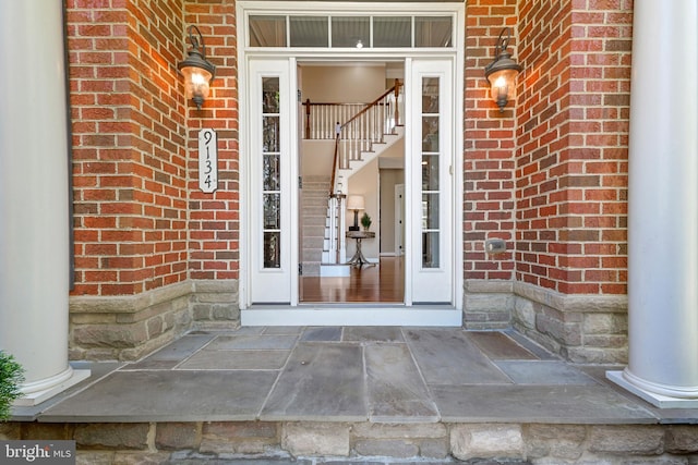property entrance with brick siding