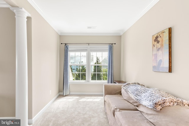 interior space featuring crown molding, visible vents, baseboards, ornate columns, and carpet