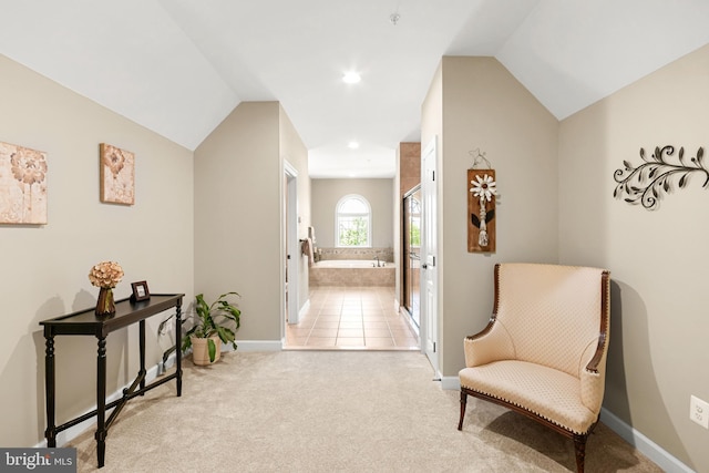 sitting room with baseboards, carpet, recessed lighting, and lofted ceiling