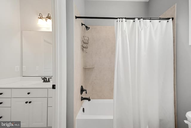 full bath featuring vanity, shower / bath combo with shower curtain, and toilet