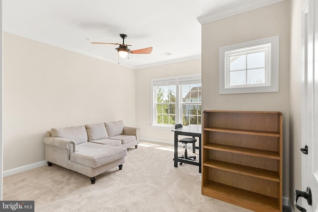 sitting room featuring baseboards, ornamental molding, ceiling fan, and carpet floors
