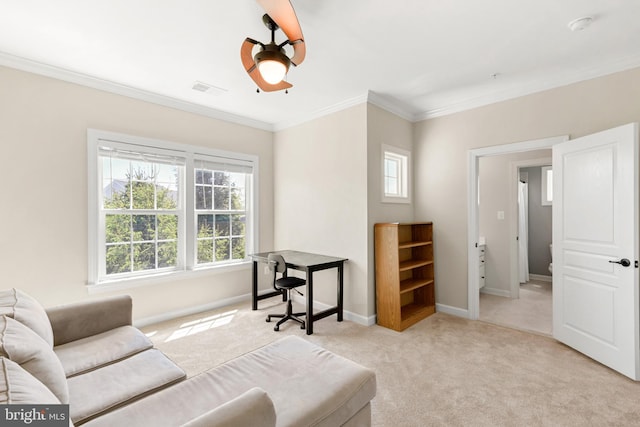 home office with carpet flooring, baseboards, visible vents, and ornamental molding