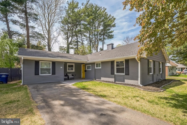 32 Meadowlark Ln, Willingboro, NJ 08046 - ranch-style home featuring a chimney, brick siding, fence, a front lawn, and a patio